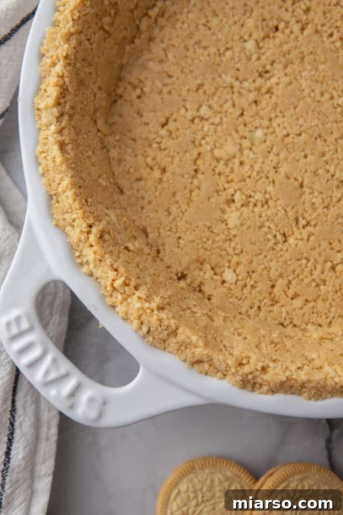Golden Oreo Pie Crust Perfection 2 Close-up shot of a golden oreo pie crust, highlighting its crispy texture and golden hue, ready for filling.