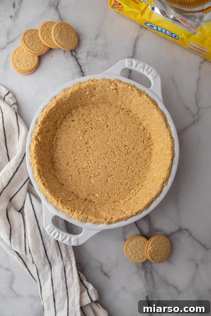 Golden Oreo Pie Crust Perfection 8 A perfectly formed golden Oreo pie crust, chilled and ready for the next step, showcasing its even texture.