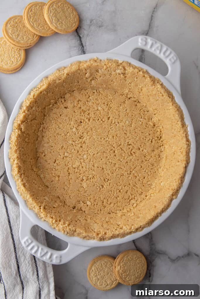 Golden Oreo Pie Crust Perfection 9 Overhead shot of a beautifully prepared golden Oreo pie crust in a dish, ready for any filling.