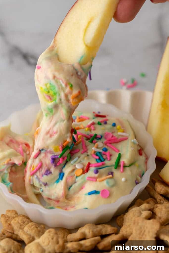 Viral High Protein Dunkaroo Recipe with an apple dipped in it