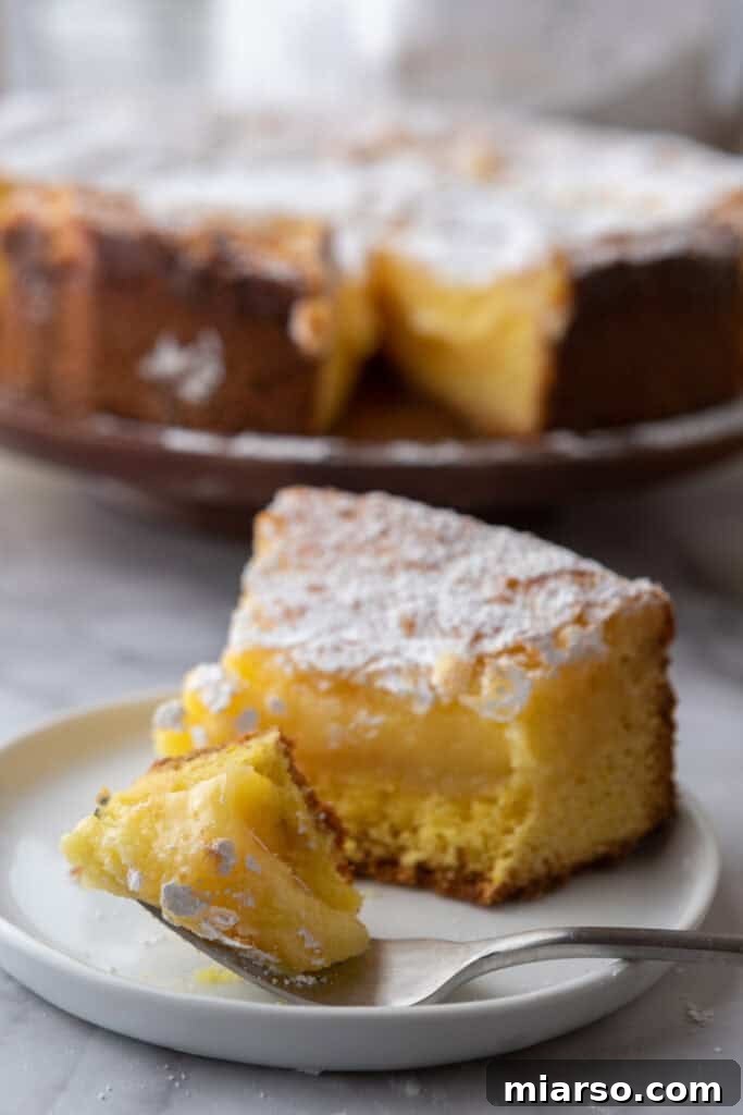 gooey butter lemon cake recipe slice on a plate