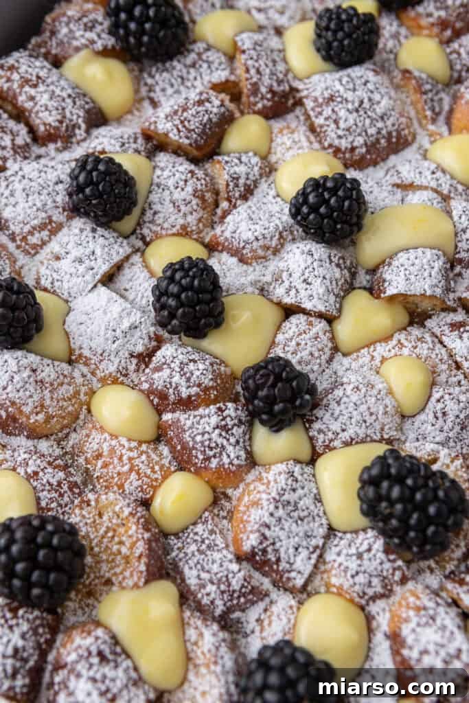 A detailed close-up of the Pretzel French Toast casserole, highlighting its rich, custardy texture, golden crust, and overall delicious appeal.