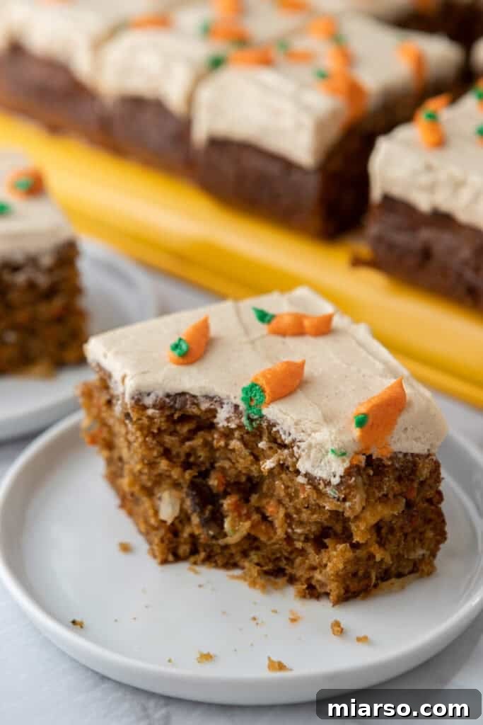 a slice of the Carrot Cake Sheet Cake