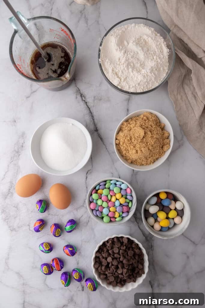 A collection of ingredients laid out, ready for making Cadbury Egg Chocolate Chip Easter Cookie Bars.
