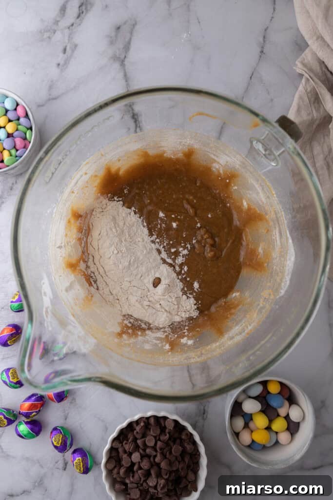 Wet and dry ingredients partially mixed.