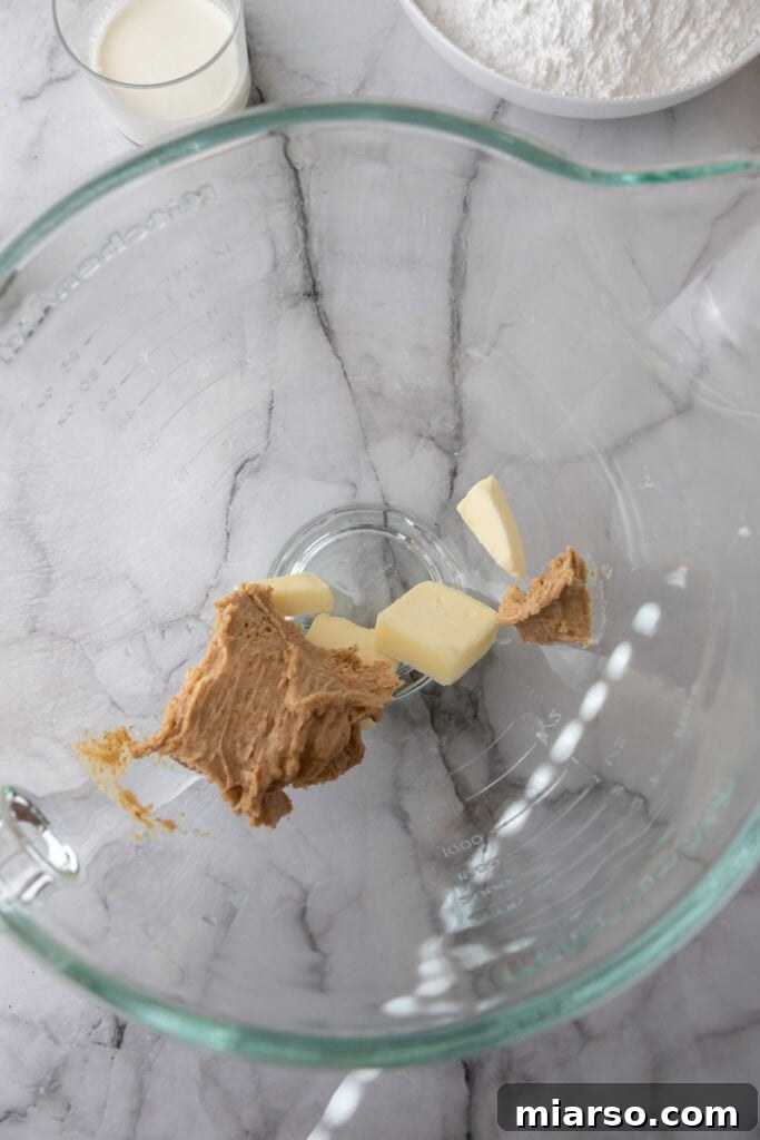 Irresistible Brown Butter Frosting 5 unmixed ingredients in a bowl