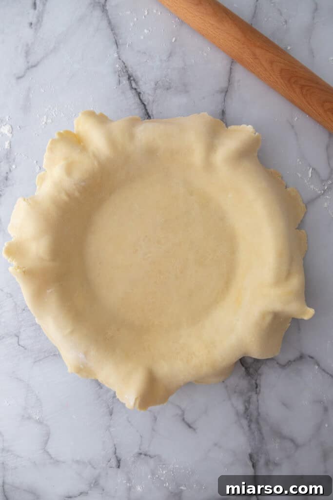 Perfect Flaky Sourdough Discard Pie Crust 14 dough in a pie pan