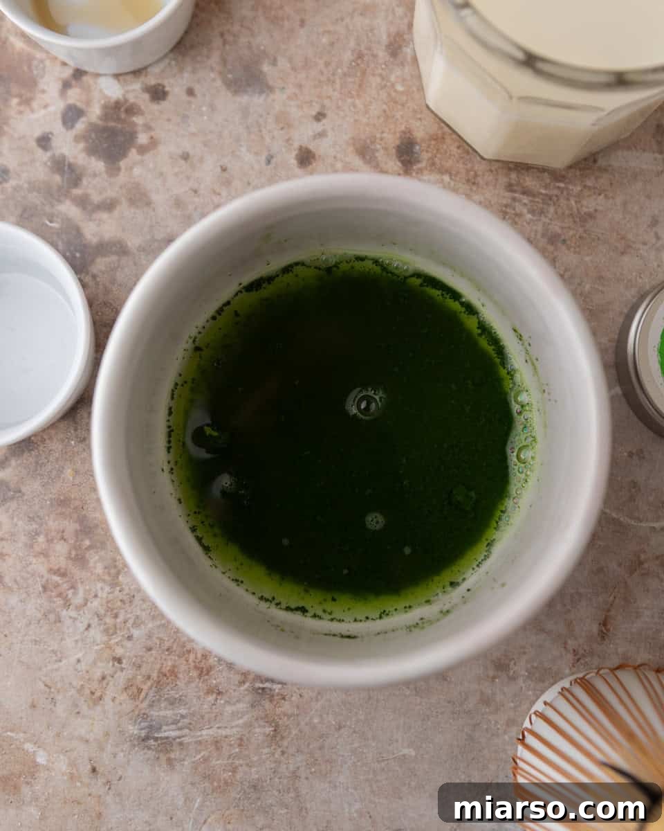 Matcha mixed with warm water before whisking
