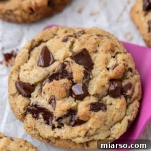 Baked cream cheese chocolate chip cookie with thick center and crisp edges