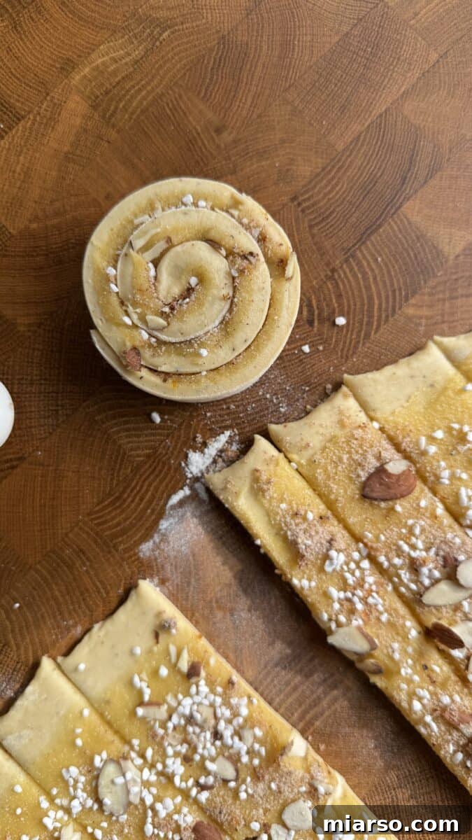Irresistible Almond Croissant Cinnamon Rolls: Bakery-Soft and Buttery 15 Almond frangipane spread thinly over rolled cinnamon roll dough