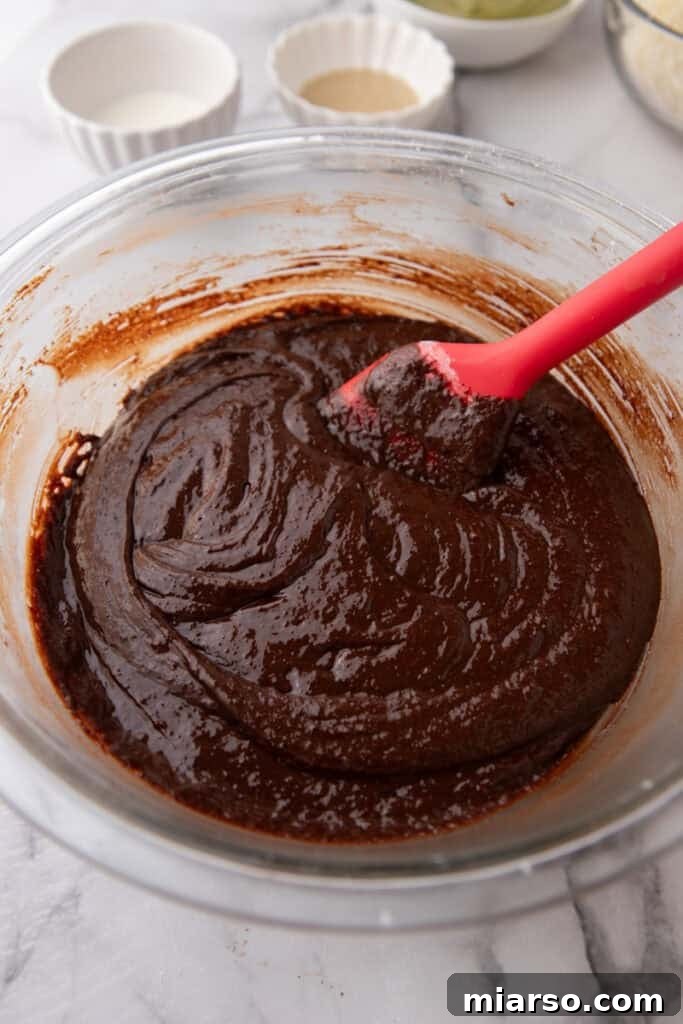 Dubai's Viral Pistachio Kunafa Brownies 11 mixed ingredients in a bowl, showing brownie batter