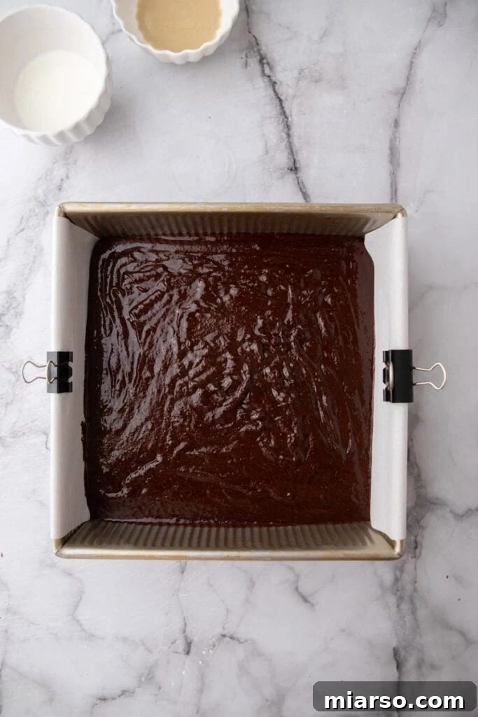 Dubai's Viral Pistachio Kunafa Brownies 12 batter in a pan, ready for baking
