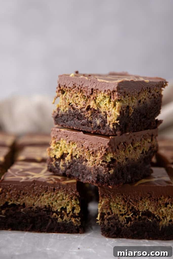 Dubai's Viral Pistachio Kunafa Brownies 21 Dubai Chocolate Brownies Recipe stacked on top of each other, ready to be served