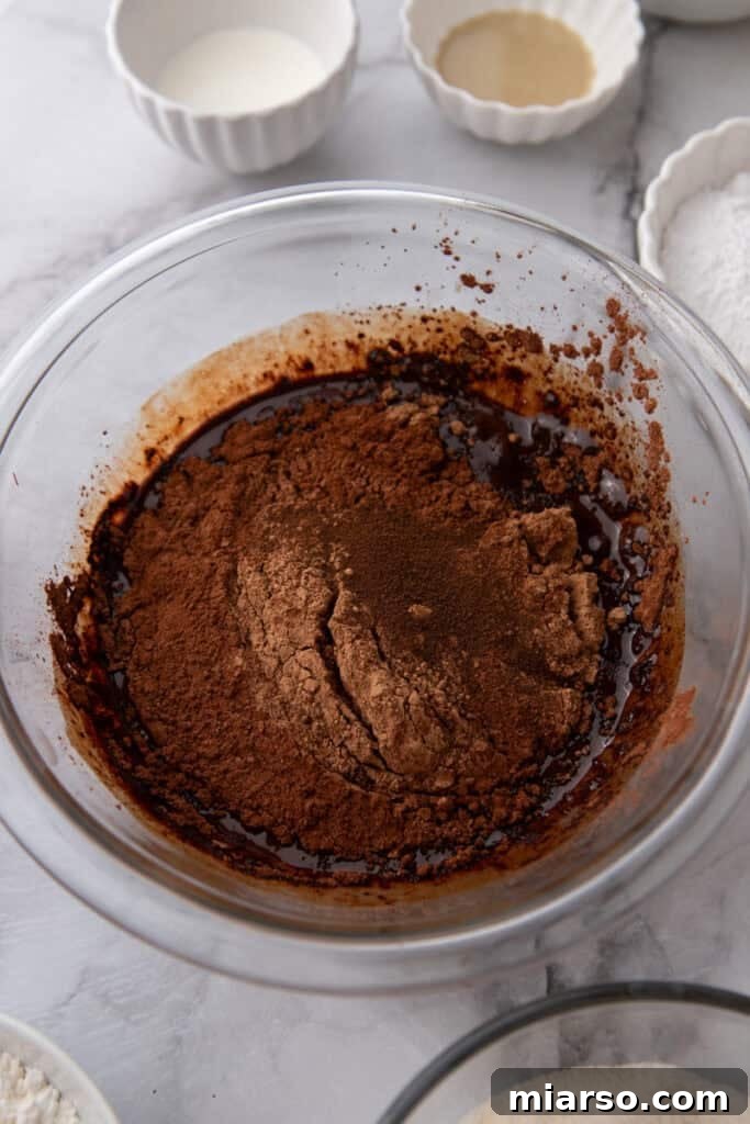 Dubai's Viral Pistachio Kunafa Brownies 8 ingredients in a bowl, showing whisked chocolate mixture