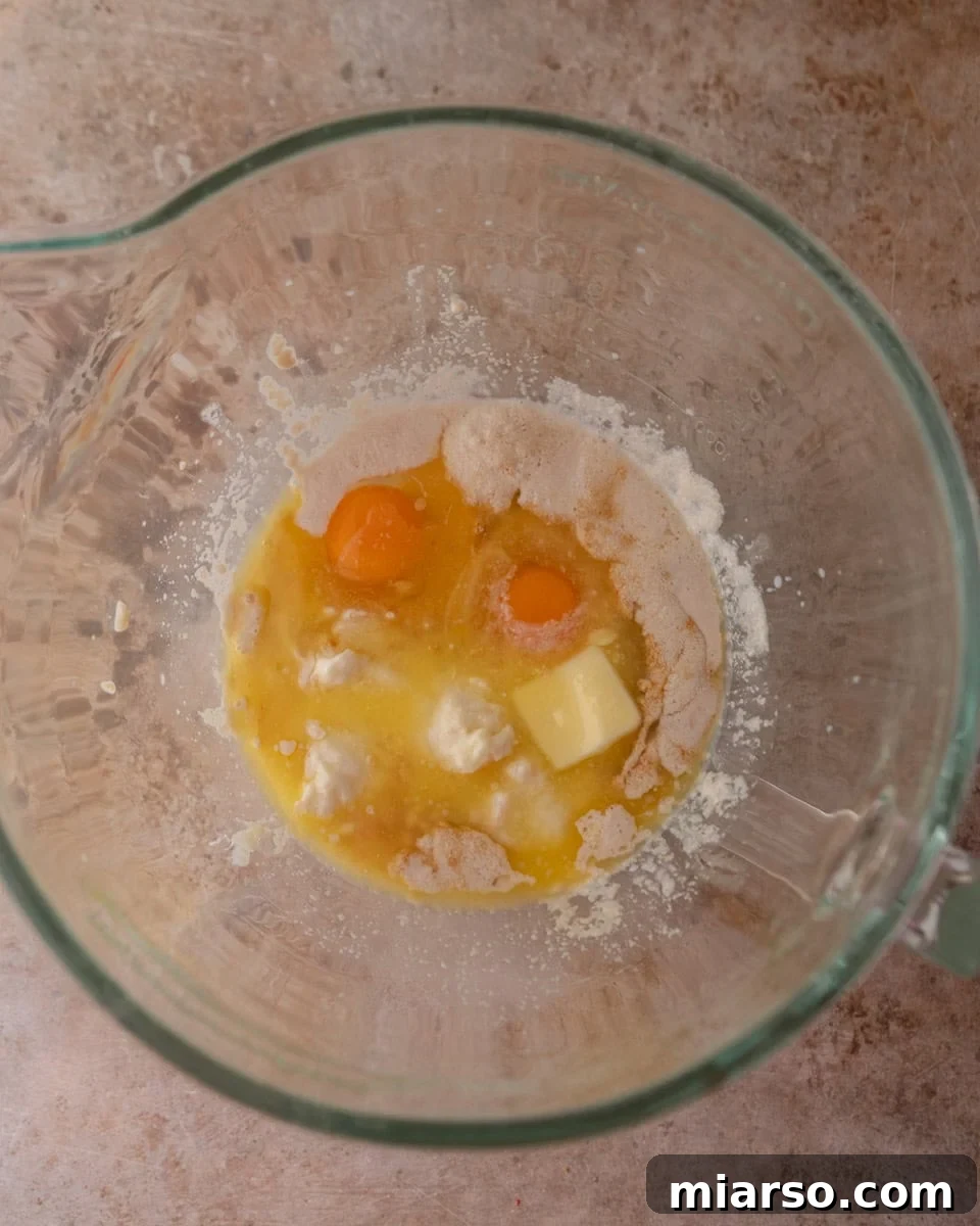 Wet ingredients in a mixing bowl before combining