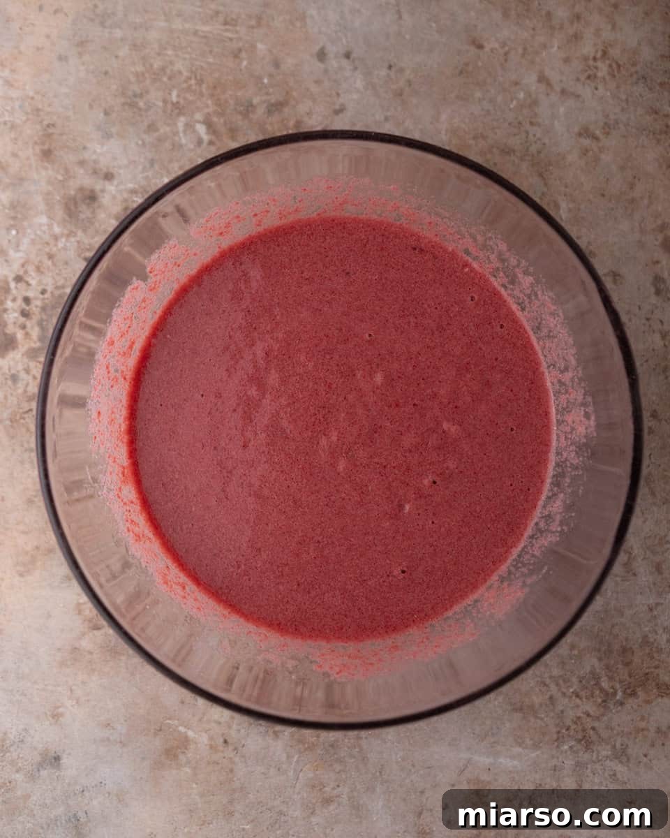 Cooked beets blended into a smooth puree in a bowl