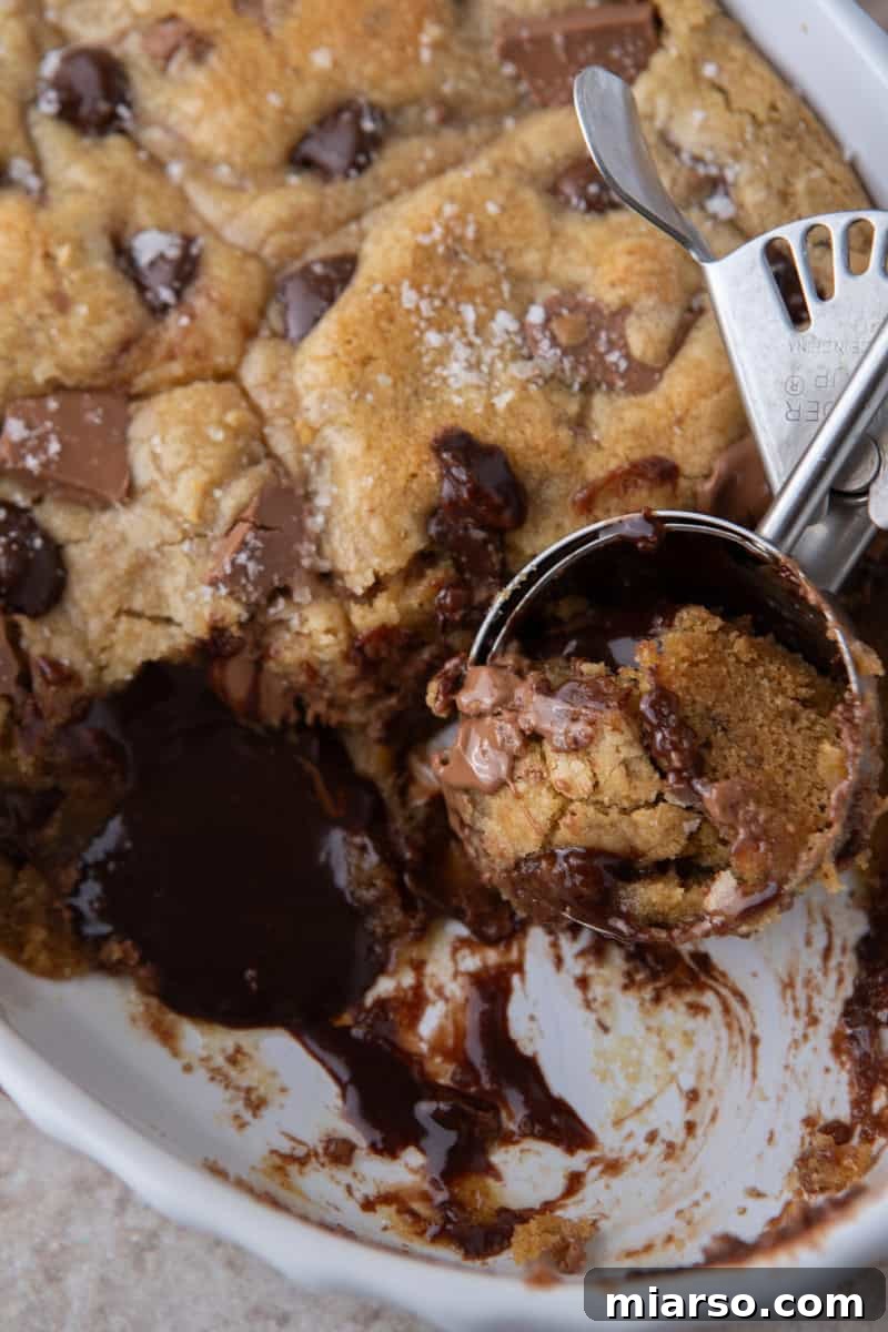 Warm chocolate chip cookie scoop with molten chocolate center