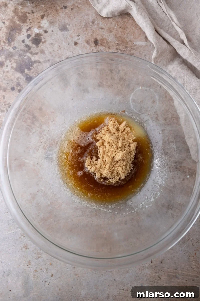 Nutty Brown Butter Chocolate Chip Skillet Cookie 4 Cooled brown butter and light brown sugar in a glass mixing bowl before whisking together for skillet cookie dough