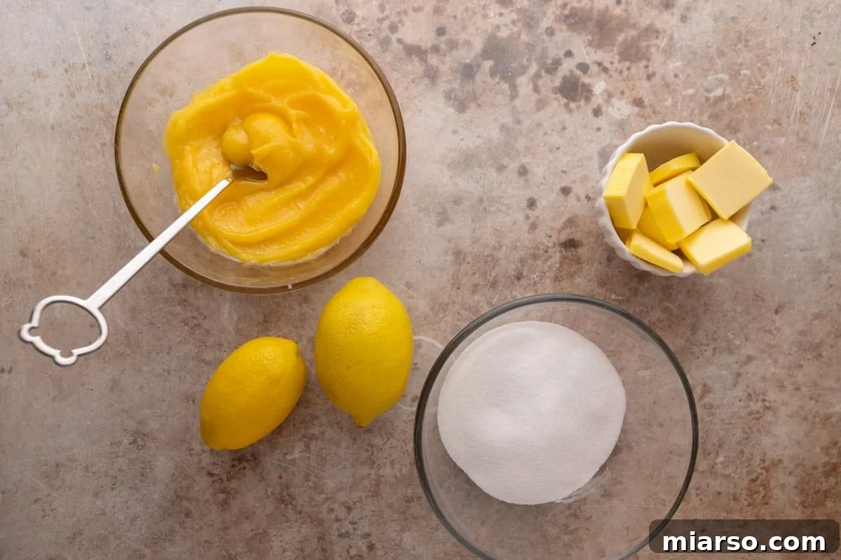 Lemon curd, butter, sugar and lemons for lemon roll filling