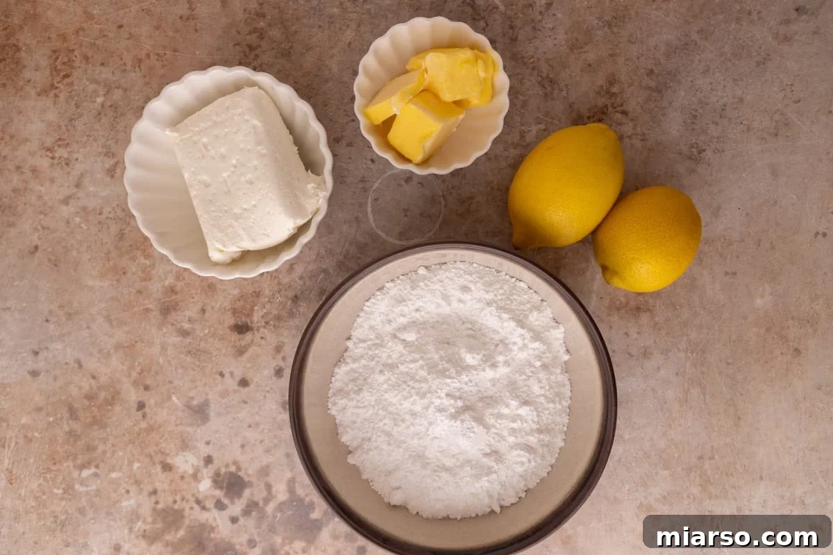 Cream cheese frosting ingredients including cream cheese, butter, powdered sugar and lemons