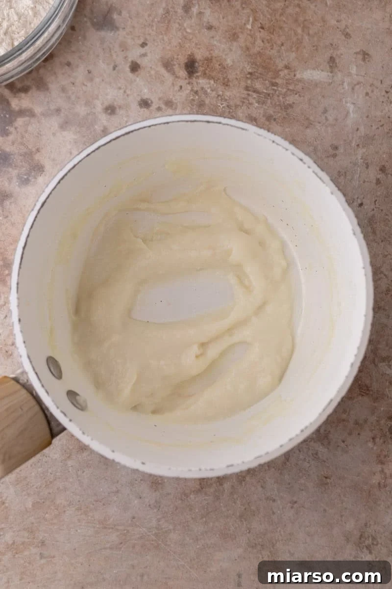 Tangzhong flour and milk paste cooked in a white saucepan