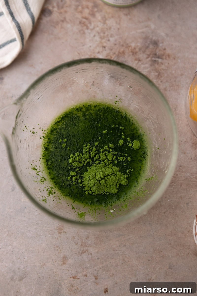 matcha powder in a glass bowl before whisking with hot water