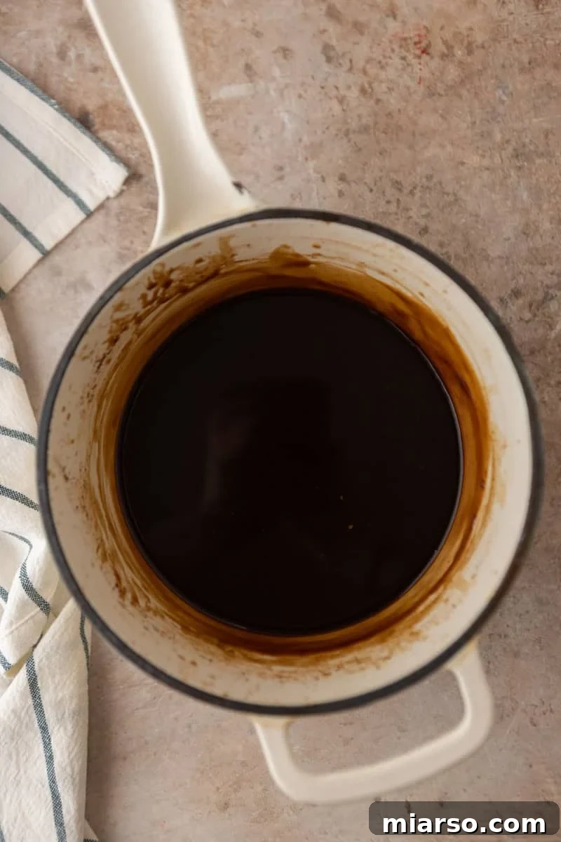 Biscoff Cookie Butter Latte Syrup 5 Coffee syrup after simmering in a saucepan, smooth and dark.