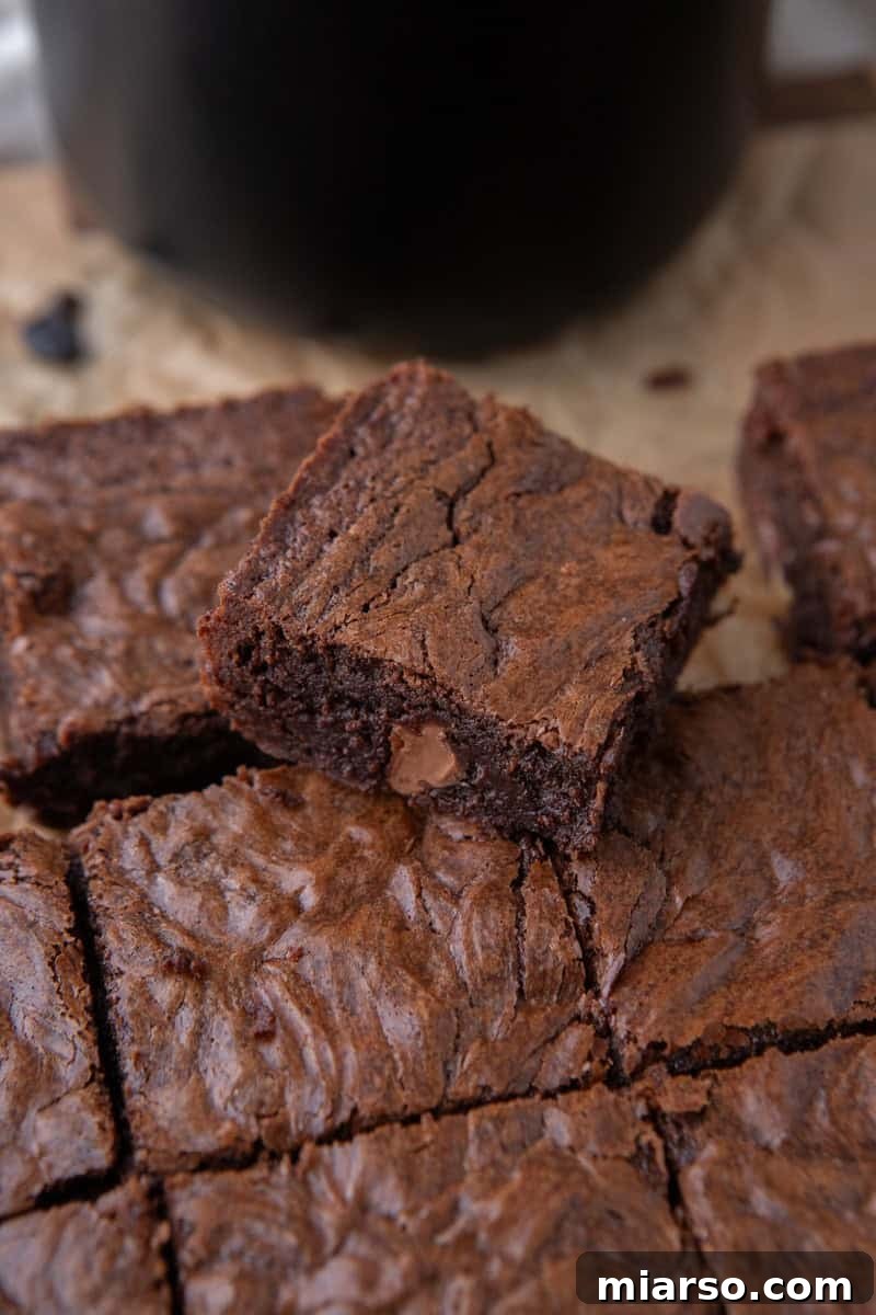 Espresso Fudge Brownies 13 Sliced fudgy coffee brownies with one piece tilted up showing the chewy dense interior