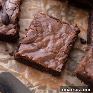 Espresso Fudge Brownies 15 Close up of a single brownie square with shiny meringue-like crinkly top