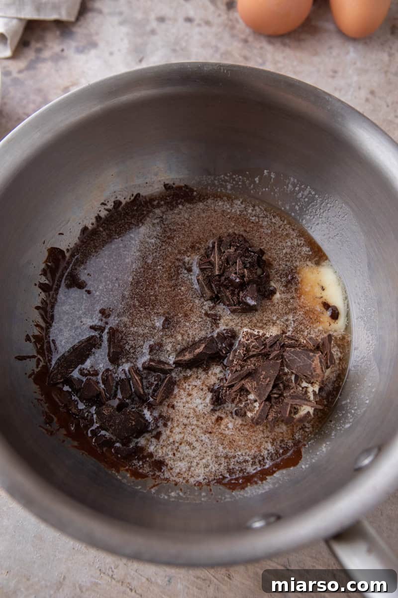 Espresso Fudge Brownies 5 Chopped dark chocolate and butter in a stainless steel saucepan before melting