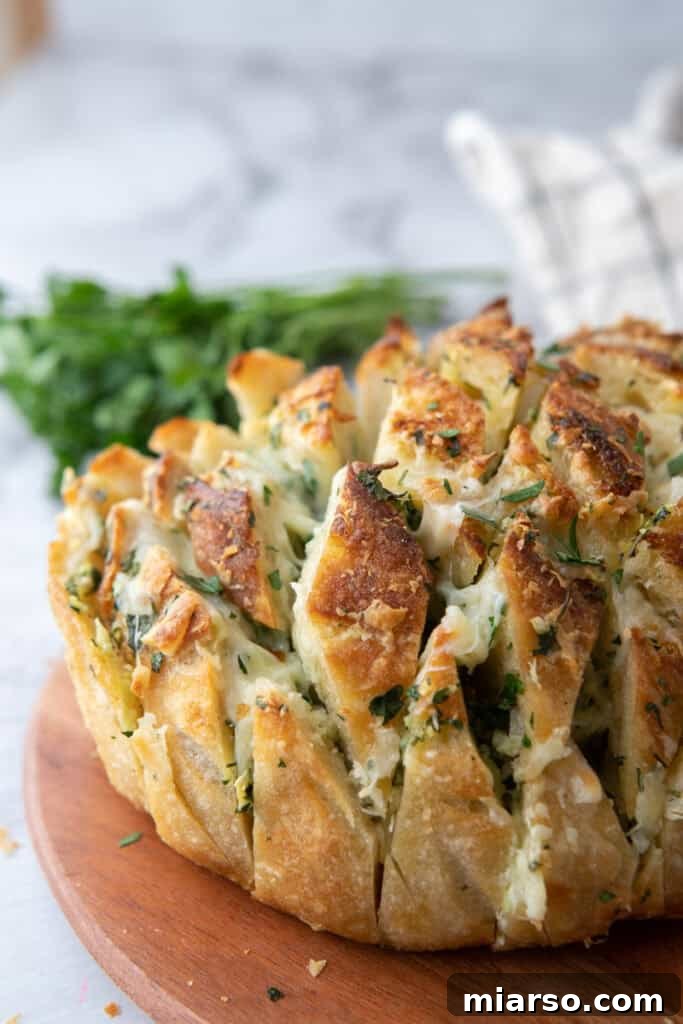 Baked garlic cheese bread made with crusty sourdough loaf

