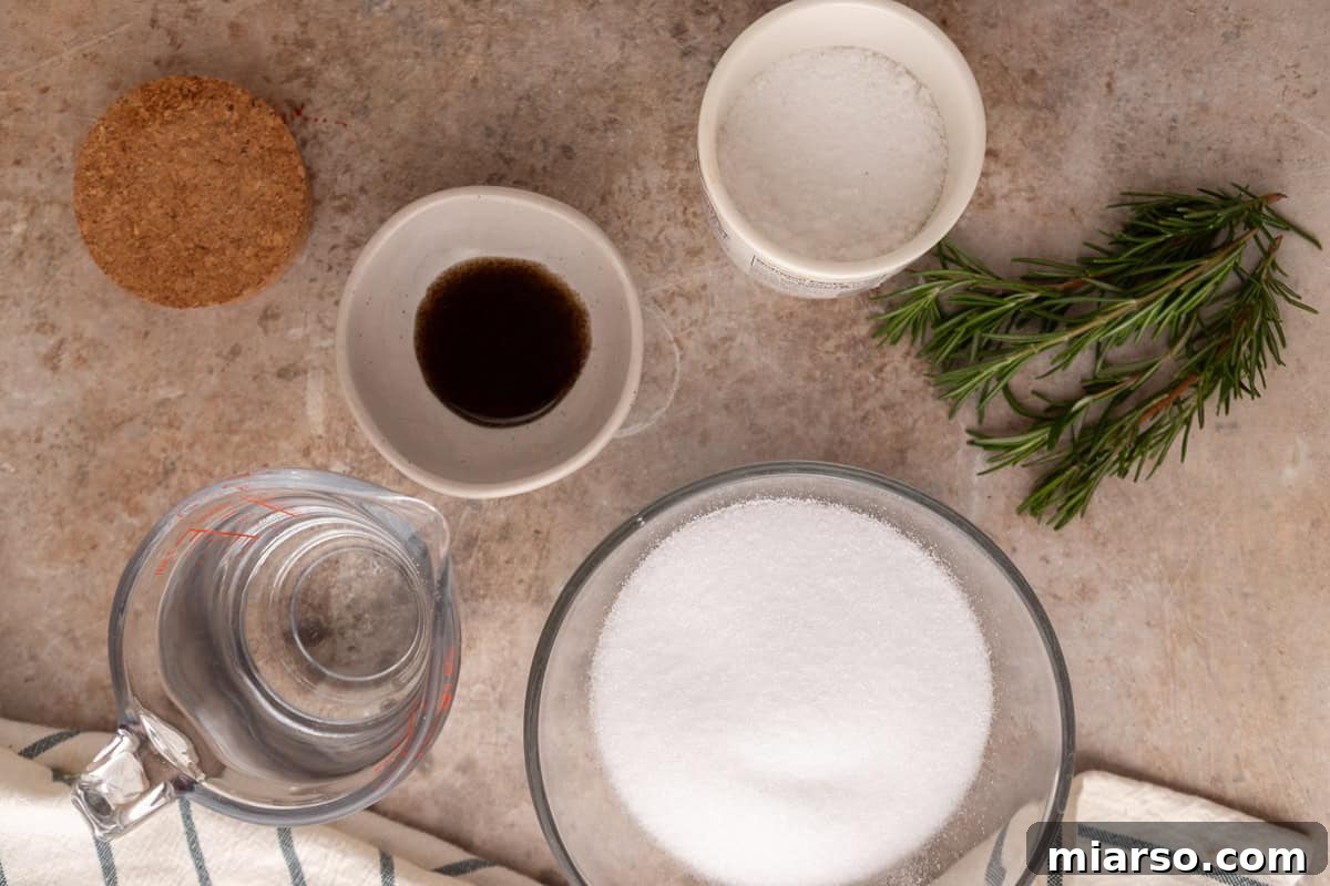 Ingredients for rosemary vanilla syrup including sugar, water, vanilla bean paste, fresh rosemary, and sea salt