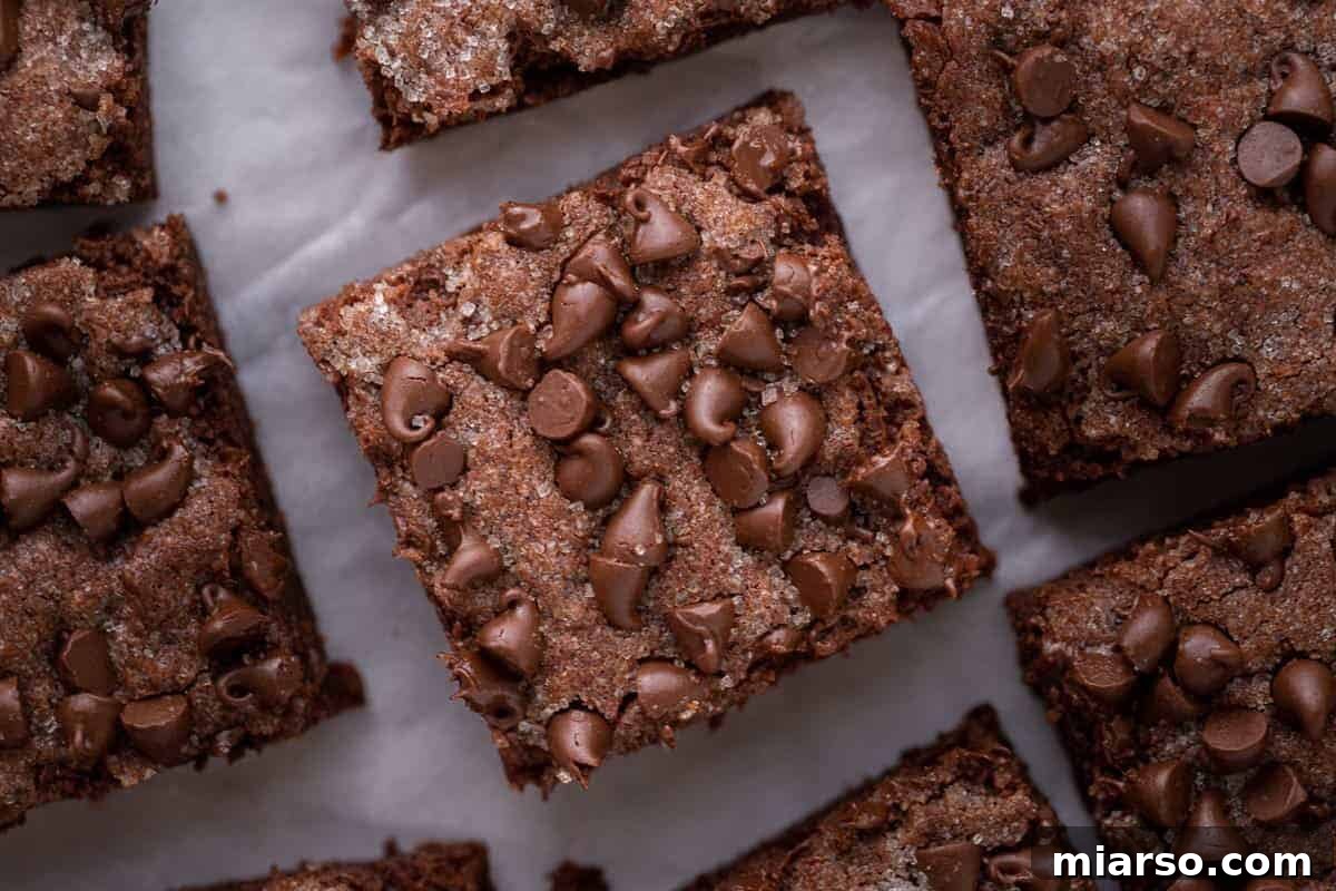 Chocolate sugar cookie bars topped with melty chocolate chips, an easy Mother's Day dessert recipe to gift or share