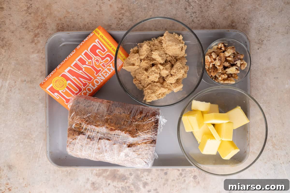 Ingredients for banana bread Christmas crack including chocolate, brown sugar, butter, walnuts, and banana bread.