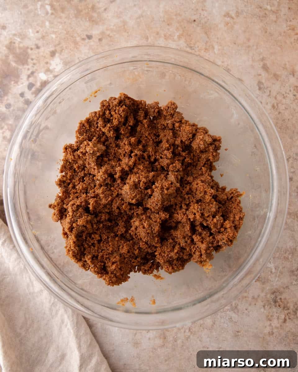 Spiced cookie butter cinnamon filling mixed into a soft, spreadable paste in a glass bowl
