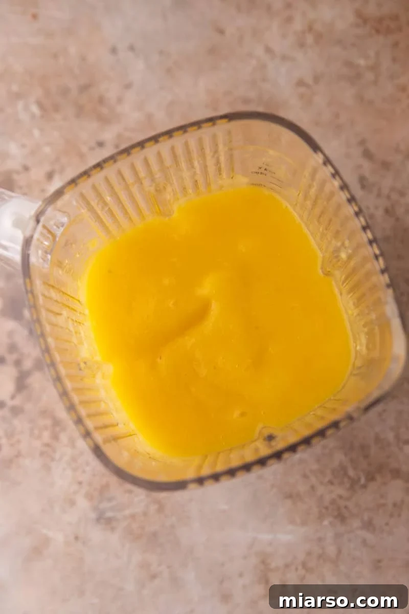Smooth blended fruit puree in a blender jar
