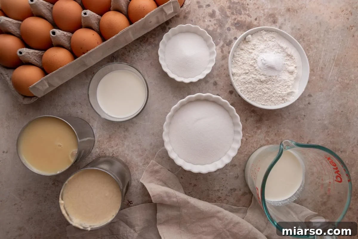Tres leches cake ingredients including eggs, flour, sugar, milk, evaporated milk, and condensed milk