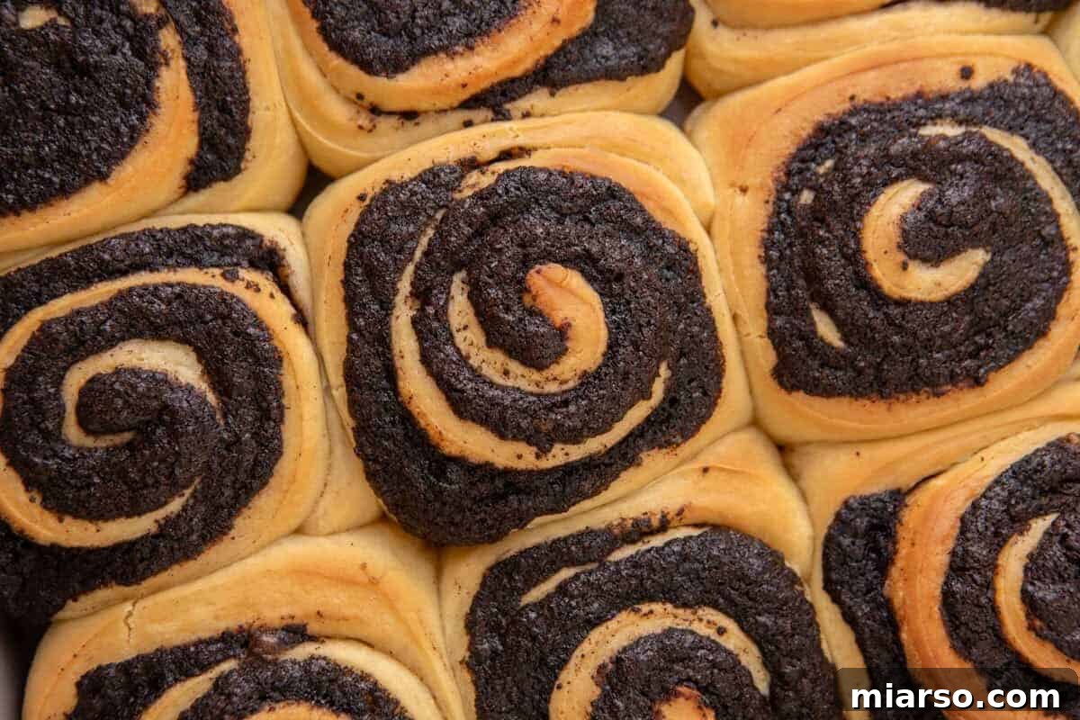 Oreo-Stuffed Cinnamon Rolls with Cream Cheese Glaze 11 Baked Oreo cinnamon rolls with golden dough and dark Oreo filling swirls