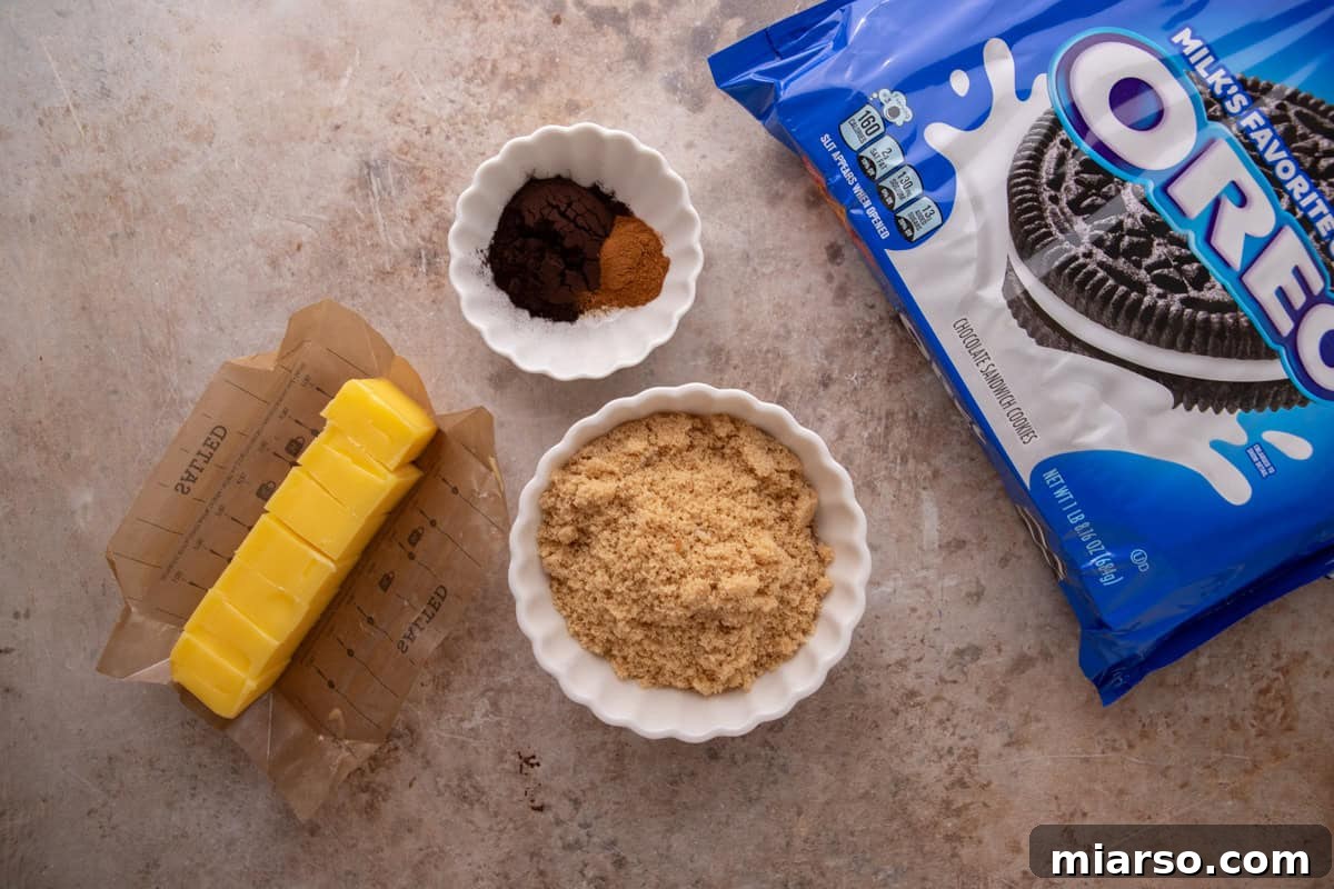 Oreo-Stuffed Cinnamon Rolls with Cream Cheese Glaze 4 Oreo cinnamon roll filling ingredients with black cocoa, brown sugar, butter, and Oreos