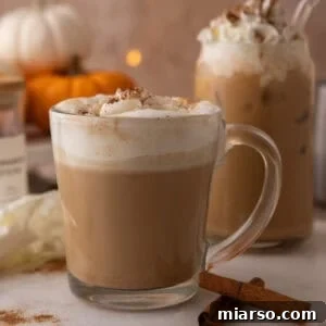 Make a Copycat Starbucks Pumpkin Spice Latte at Home 13 Copycat Starbucks pumpkin spice latte in a glass mug with whipped cream and spice dusting.
